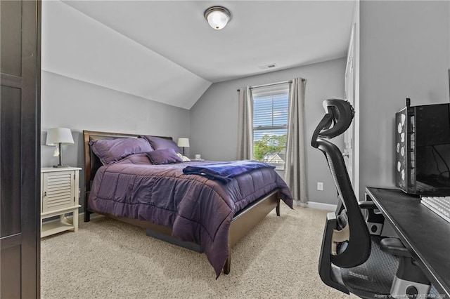 bedroom with visible vents, baseboards, vaulted ceiling, and light carpet