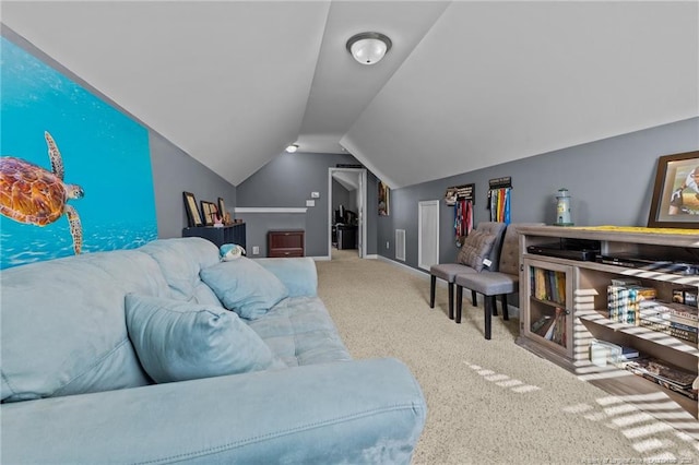 carpeted living area with baseboards and vaulted ceiling