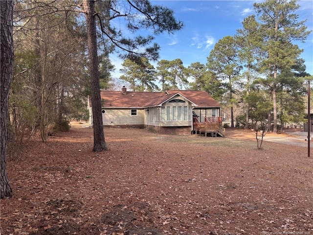 5423 Fisher Rd, Fayetteville, NC 28304 - ranch-style home featuring a wooden deck and a chimney