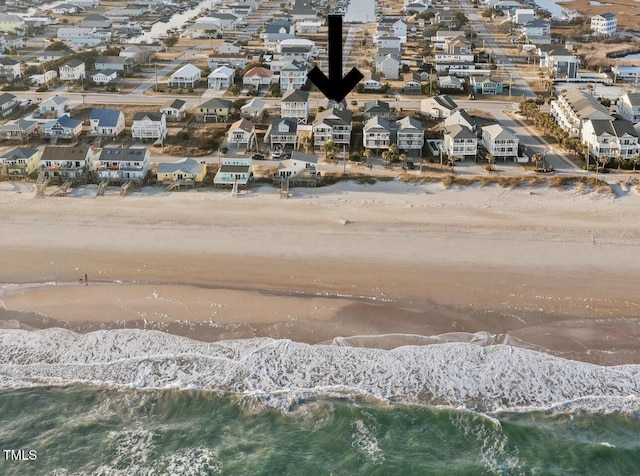 aerial view featuring a water view, a residential view, and a view of the beach