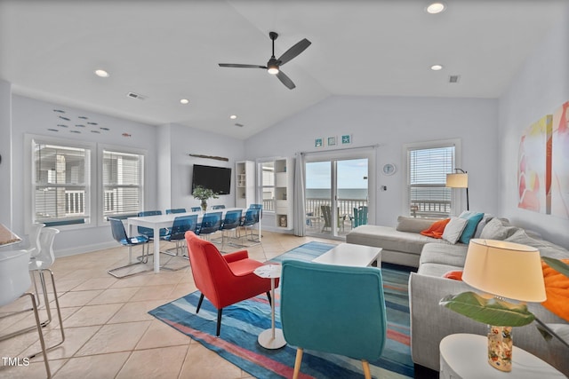 living room with visible vents, light tile patterned floors, ceiling fan, and vaulted ceiling