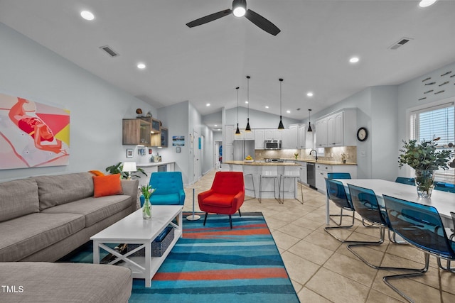 living area with light tile patterned floors, visible vents, vaulted ceiling, and a ceiling fan