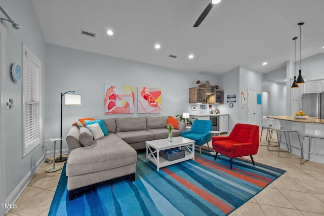 living area with light tile patterned floors, recessed lighting, and visible vents