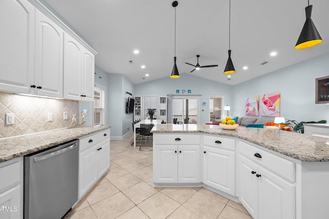 kitchen with pendant lighting, stainless steel dishwasher, ceiling fan, lofted ceiling, and backsplash