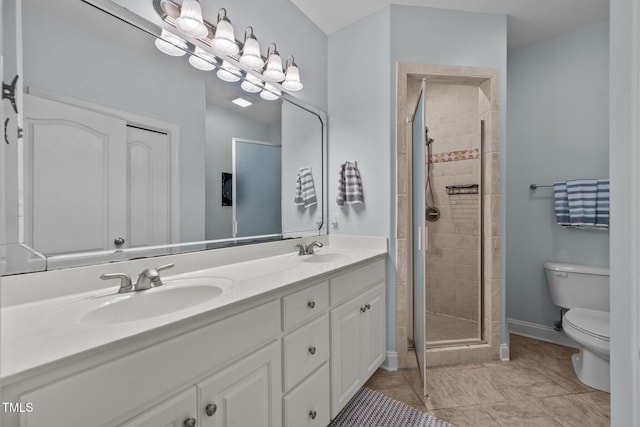 full bathroom with a shower stall, a sink, and toilet