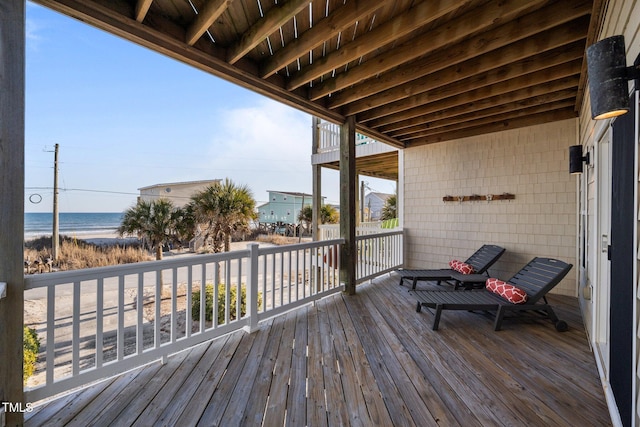 wooden terrace with a water view