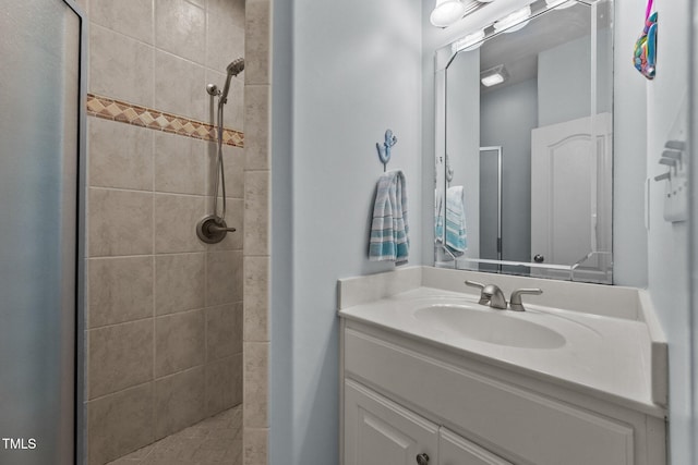 bathroom featuring a stall shower and vanity