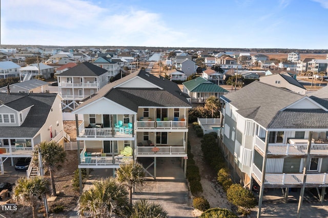 birds eye view of property with a residential view