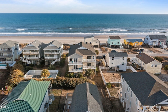 drone / aerial view with a water view and a view of the beach