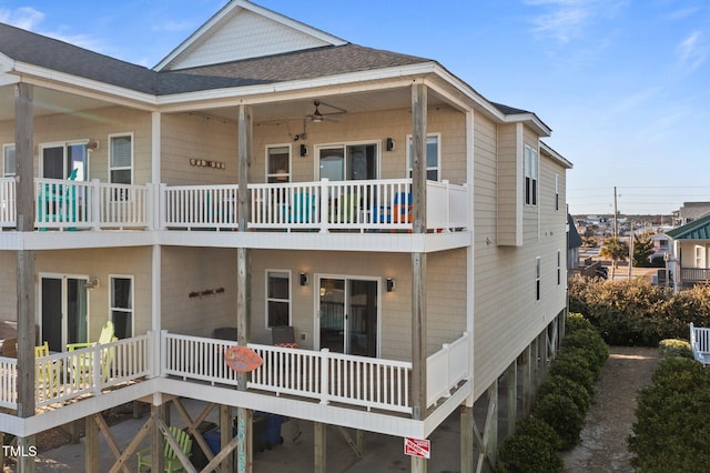 exterior space featuring a shingled roof