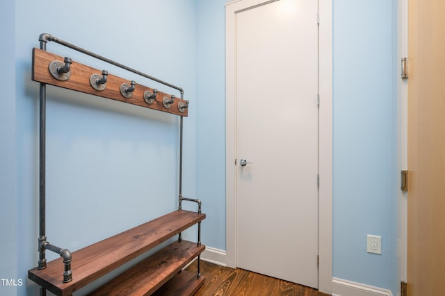 mudroom featuring baseboards and wood finished floors