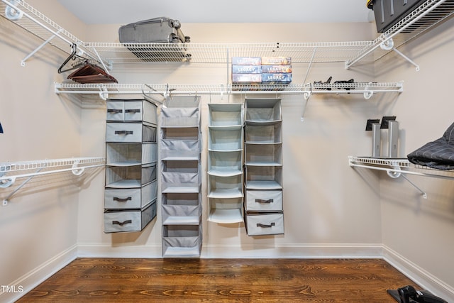 spacious closet with wood finished floors