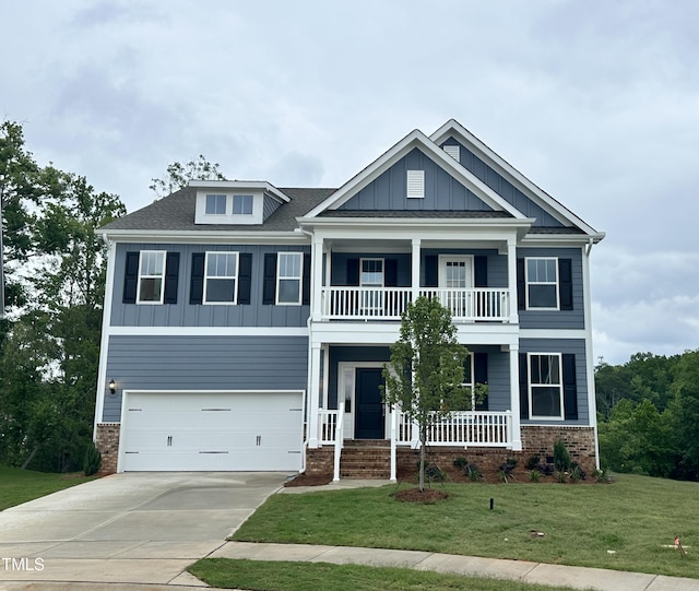 103 Berry Mill Ln Unit 133, Raleigh, NC 27603 - view of front facade featuring a balcony, a porch, driveway, a garage, and board and batten siding