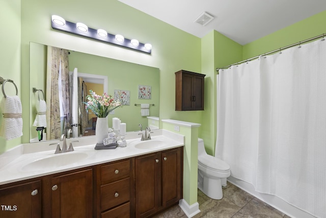 full bath featuring toilet, double vanity, tile patterned flooring, and shower / bathtub combination with curtain