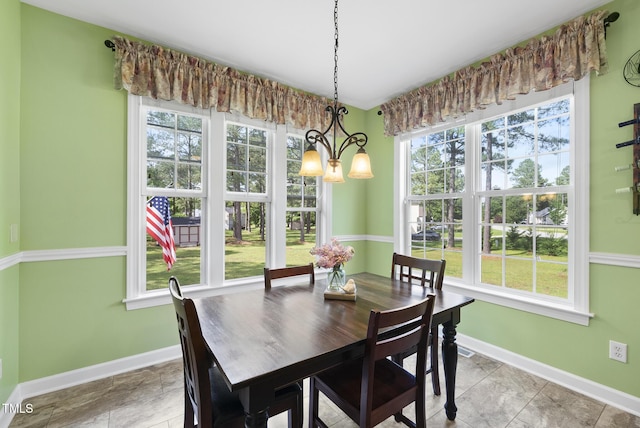 dining area with baseboards and plenty of natural light