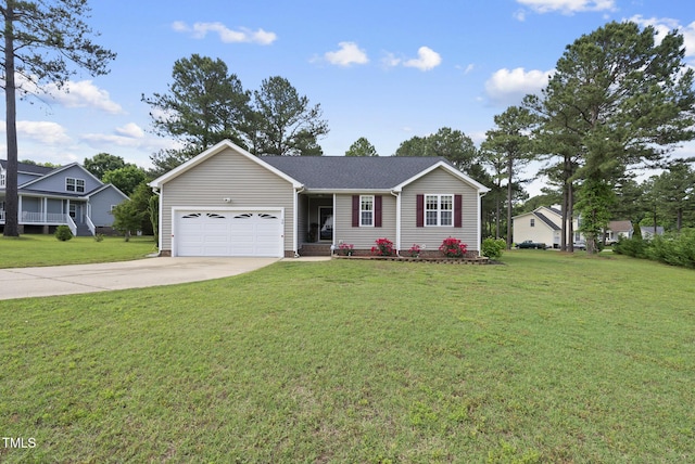 ranch-style home with driveway, a garage, and a front lawn