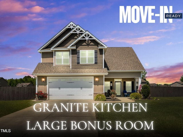 203 Ingram Fields Dr, Goldsboro, NC 27530 - view of front facade with a garage, concrete driveway, a shingled roof, and board and batten siding