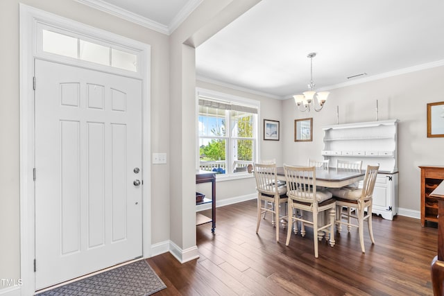 240 Liberty Star Rd, Wendell, NC 27591 - foyer entrance with a chandelier, baseboards, dark wood-style floors, and crown molding