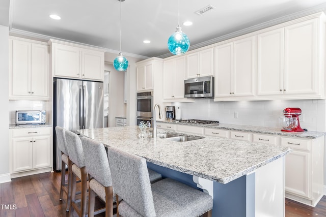 240 Liberty Star Rd, Wendell, NC 27591 - kitchen with stainless steel appliances, a sink, a breakfast bar, dark wood-style flooring, and recessed lighting