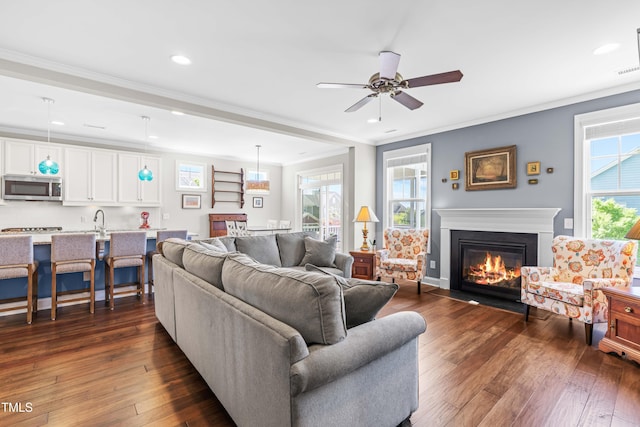 240 Liberty Star Rd, Wendell, NC 27591 - living room featuring a ceiling fan, recessed lighting, crown molding, a glass covered fireplace, and dark wood-style flooring