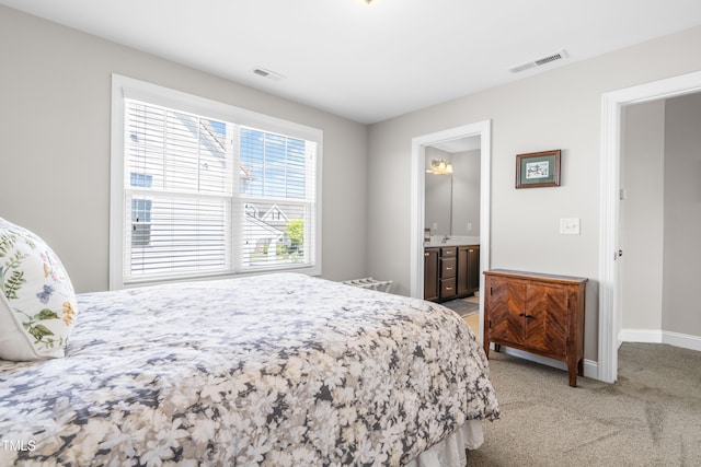 240 Liberty Star Rd, Wendell, NC 27591 - bedroom with light carpet, baseboards, and ensuite bathroom