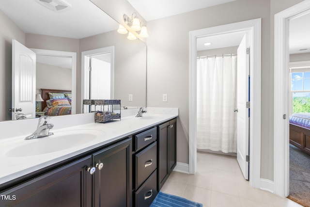 240 Liberty Star Rd, Wendell, NC 27591 - ensuite bathroom with baseboards, double vanity, and tile patterned floors