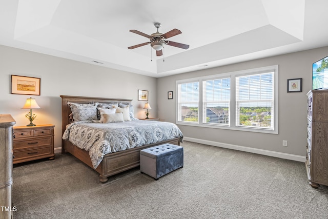 240 Liberty Star Rd, Wendell, NC 27591 - carpeted bedroom with a tray ceiling, baseboards, and ceiling fan