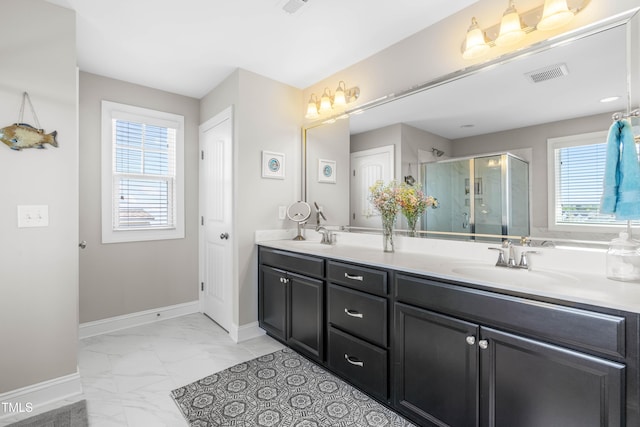 240 Liberty Star Rd, Wendell, NC 27591 - full bath with marble look tile flooring, plenty of natural light, double vanity, and a shower stall