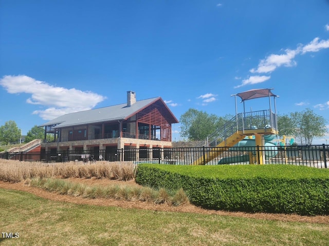 240 Liberty Star Rd, Wendell, NC 27591 - rear view of house featuring fence, a playground, and a chimney