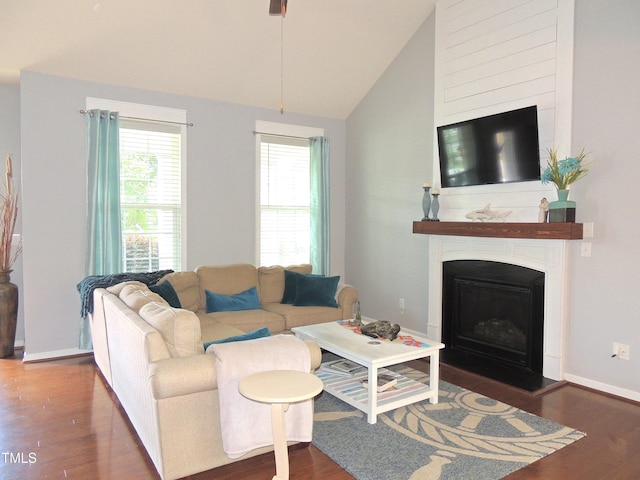 3530 Winding Walk Ct, Raleigh, NC 27616 - living room featuring wood finished floors, vaulted ceiling, a fireplace, baseboards, and a ceiling fan