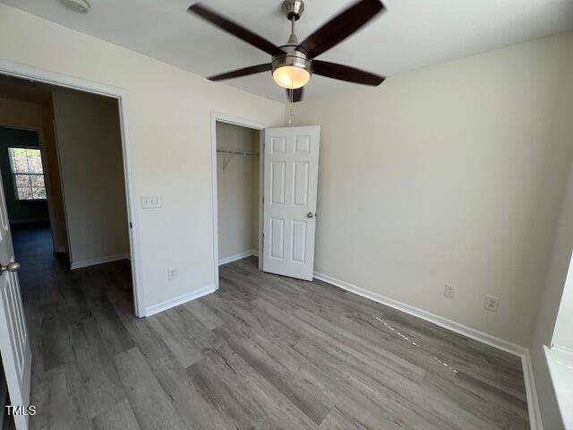 8013 River Water Ct, Raleigh, NC 27616 - unfurnished bedroom with a ceiling fan, wood finished floors, baseboards, and a closet