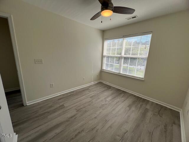 8013 River Water Ct, Raleigh, NC 27616 - empty room with ceiling fan, visible vents, baseboards, and wood finished floors