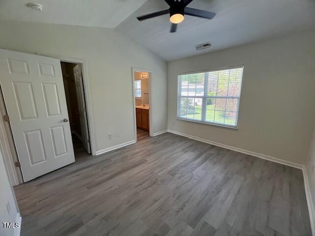 8013 River Water Ct, Raleigh, NC 27616 - unfurnished bedroom featuring baseboards, a ceiling fan, visible vents, lofted ceiling, and wood finished floors