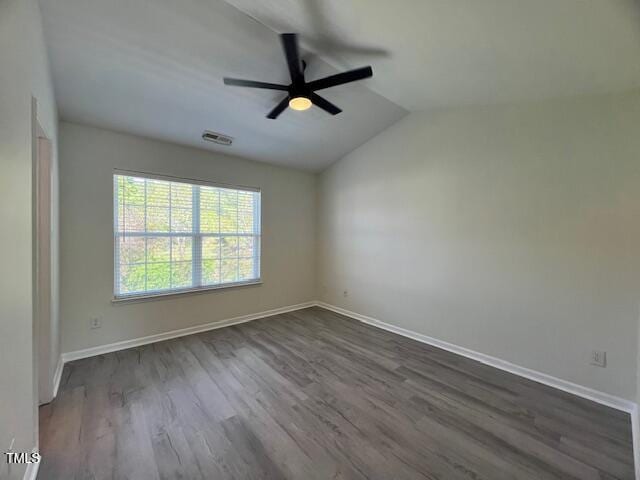 8013 River Water Ct, Raleigh, NC 27616 - spare room featuring dark wood-style floors, baseboards, a ceiling fan, and lofted ceiling