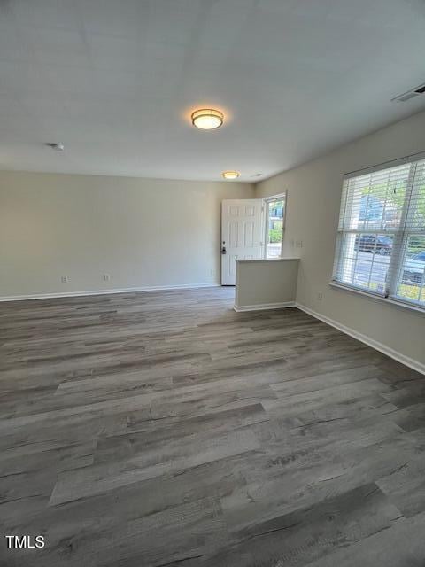 8013 River Water Ct, Raleigh, NC 27616 - unfurnished room with wood finished floors, baseboards, and visible vents