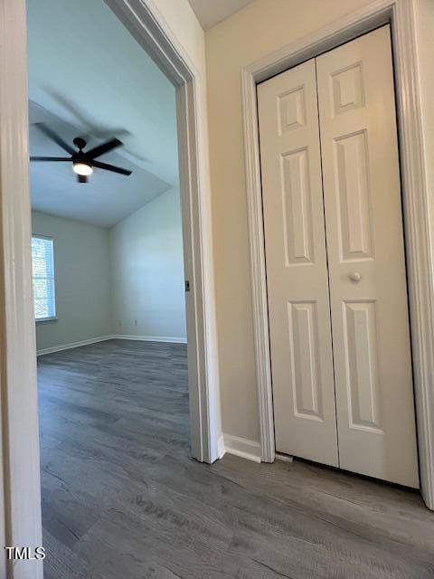 8013 River Water Ct, Raleigh, NC 27616 - hallway featuring dark wood-type flooring, baseboards, and vaulted ceiling