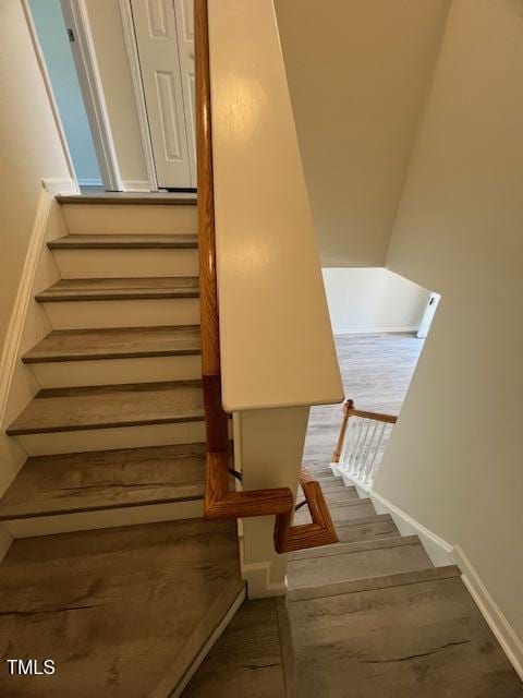 8013 River Water Ct, Raleigh, NC 27616 - stairs with wood finished floors and baseboards
