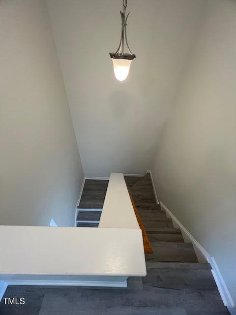 8013 River Water Ct, Raleigh, NC 27616 - stairway with wood finished floors and baseboards