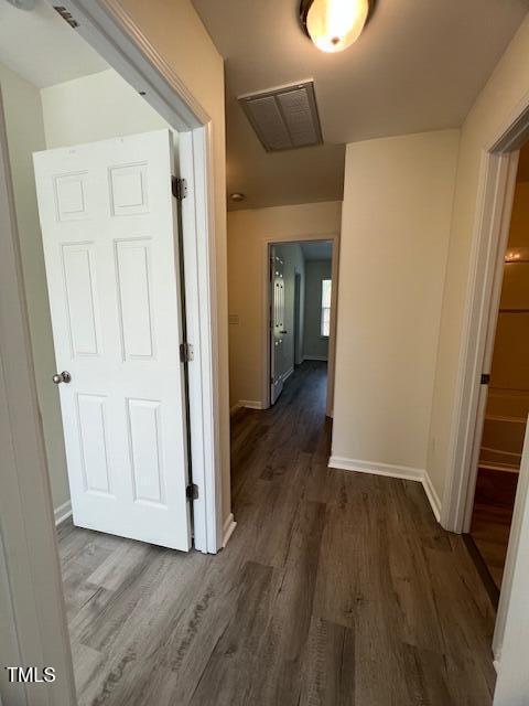 8013 River Water Ct, Raleigh, NC 27616 - hall with wood finished floors and baseboards