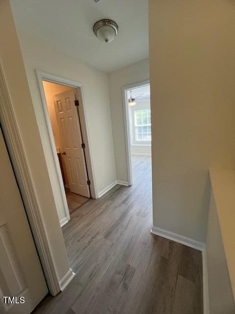 8013 River Water Ct, Raleigh, NC 27616 - hallway with baseboards and wood finished floors