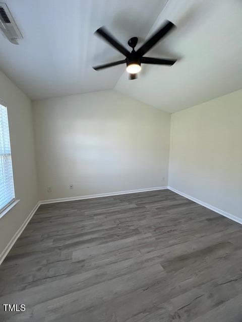 8013 River Water Ct, Raleigh, NC 27616 - spare room featuring vaulted ceiling, baseboards, wood finished floors, and ceiling fan