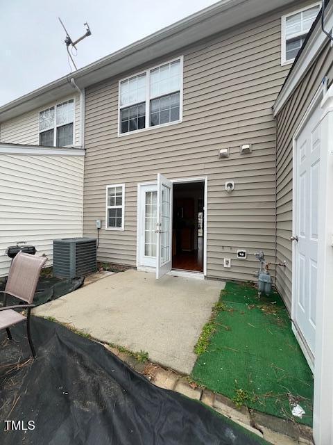 8013 River Water Ct, Raleigh, NC 27616 - back of property with a patio and central AC