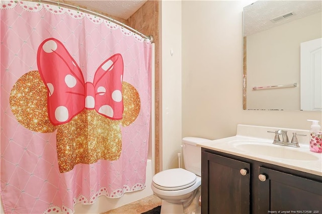 full bath featuring a textured ceiling, visible vents, vanity, toilet, and shower / bathtub combination with curtain