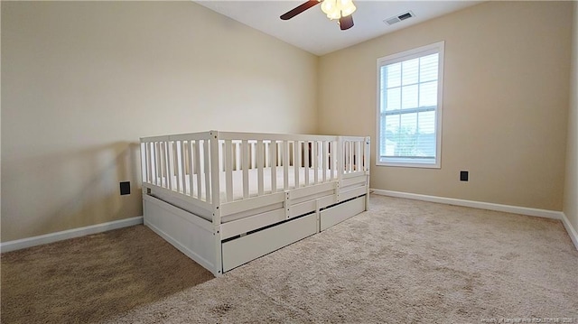 bedroom with visible vents, carpet flooring, and baseboards