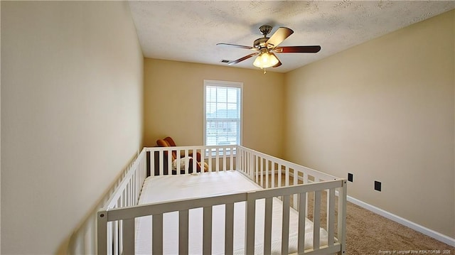 bedroom featuring carpet floors, baseboards, and ceiling fan