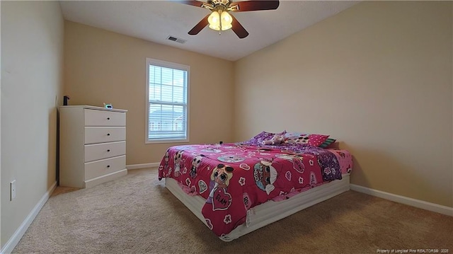 bedroom with carpet flooring, a ceiling fan, baseboards, and visible vents