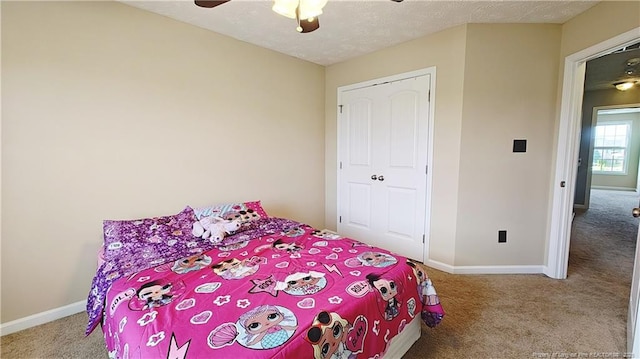 bedroom with carpet floors and baseboards