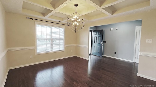 1221 Piping Plover Ct, Fayetteville, NC 28306 - spare room with coffered ceiling, dark wood-style flooring, a chandelier, baseboards, and beamed ceiling