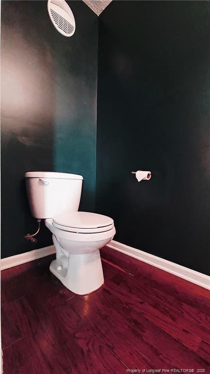 1221 Piping Plover Ct, Fayetteville, NC 28306 - bathroom with toilet, wood finished floors, and baseboards