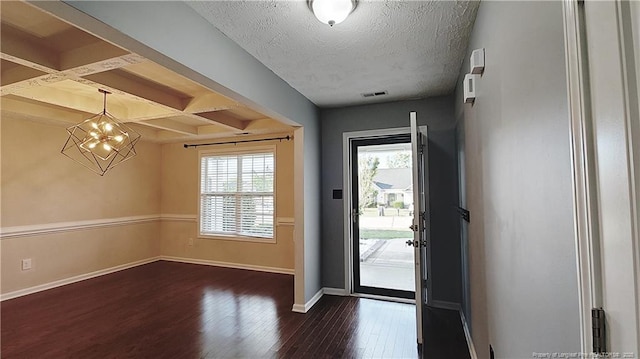 1221 Piping Plover Ct, Fayetteville, NC 28306 - foyer featuring dark wood-type flooring, coffered ceiling, baseboards, a chandelier, and beam ceiling